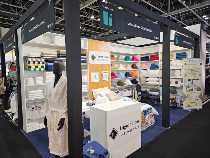 Lagoon stand at The Hotel Show, Dubai, with towels, bathrobes and bed linen